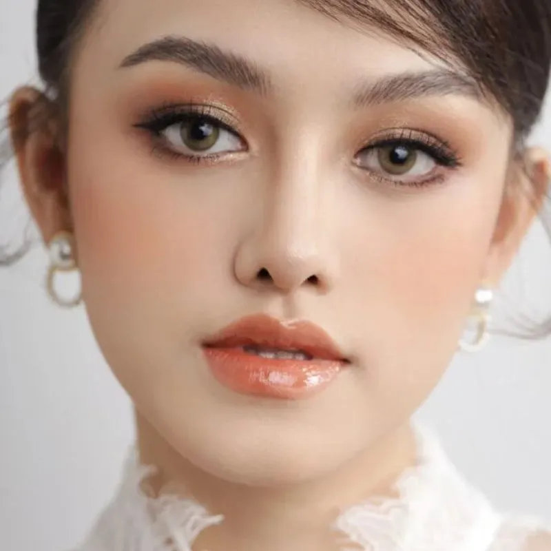 Makeup cô dâu tone cam ánh nhũ